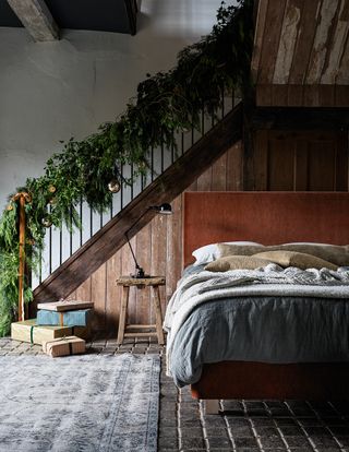 Christmas stair garland in a bedroom