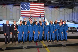 NASA's 23rd class of astronaut candidates pose with NASA leaders and congressional officials at Ellington Field, near Johnson Space Center, in Houston, Texas, at the conclusion of their announcement ceremony on Monday, Dec. 6, 2021.