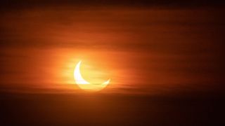 Partial solar eclipse at sunset, Montreal, Canada, in 2022