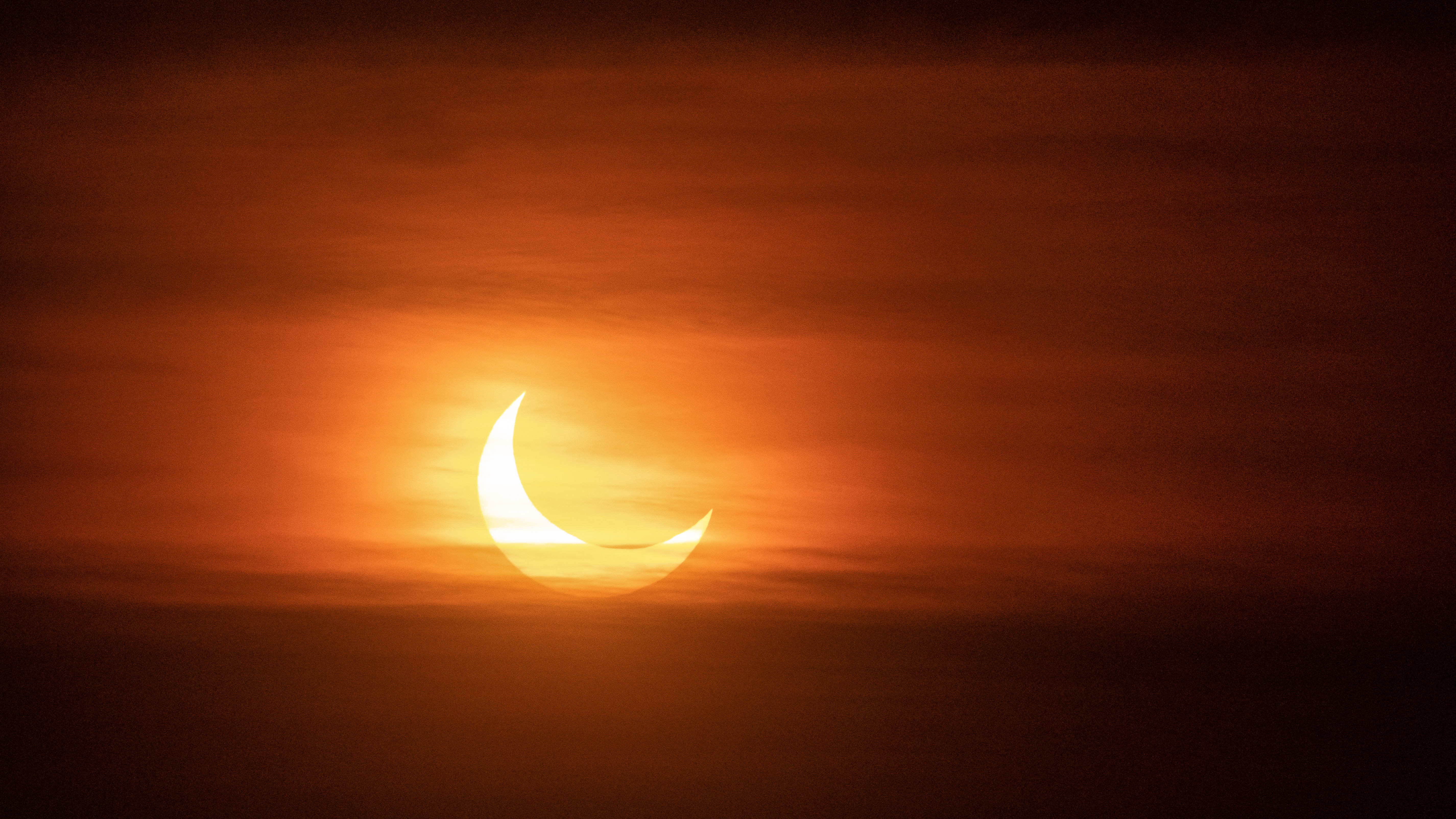Partial solar eclipse at sunset, Montreal, Canada, in 2022