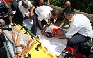 Stuart O'Grady (Team CSC) is lifted onto a stretcher