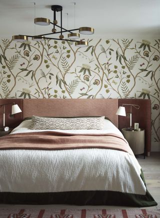 bedroom with wallpaper and orange upholstered bed