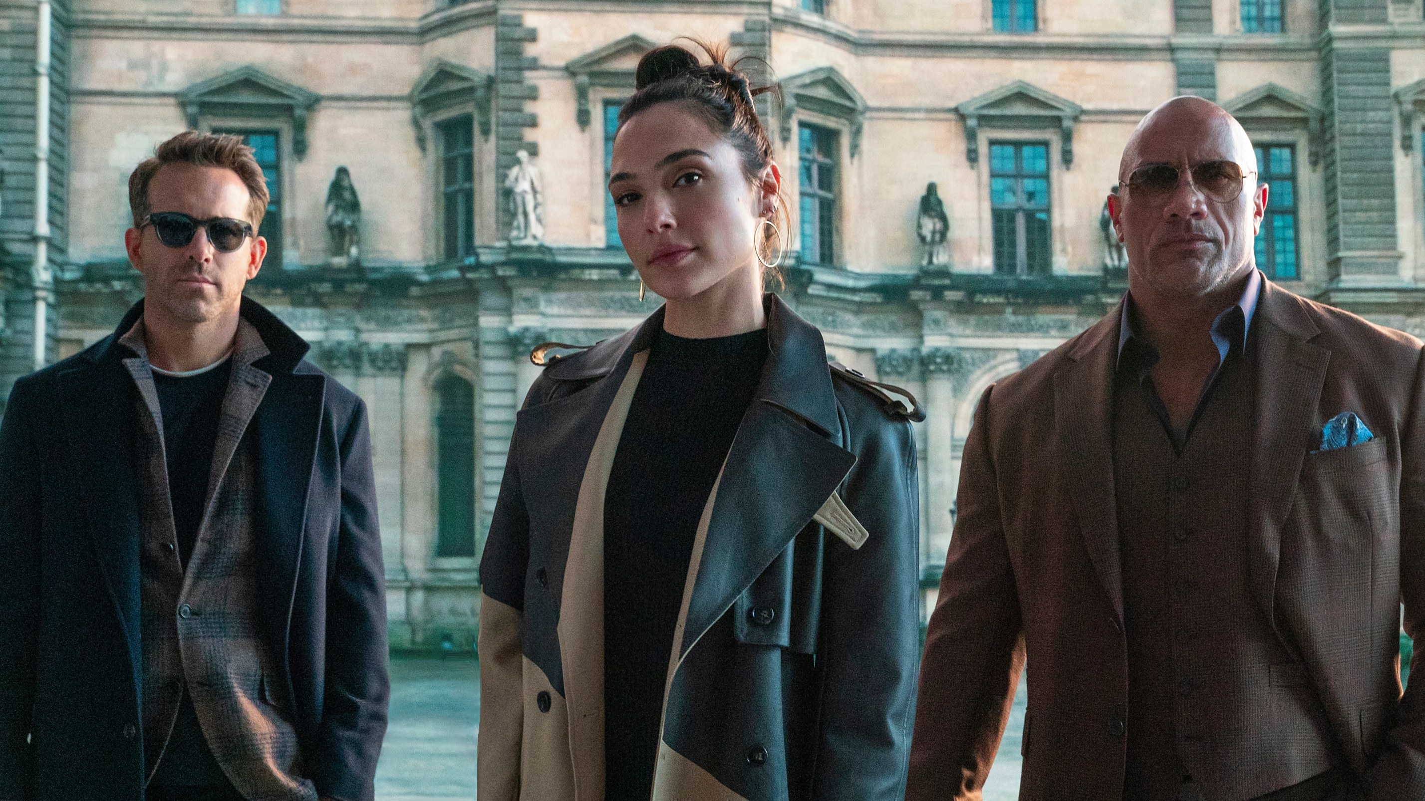 L-R: Ryan Reynolds, Gal Gadot and Dwayne "The Rock" Johnson in a scene from Netflix's "Red Notice"