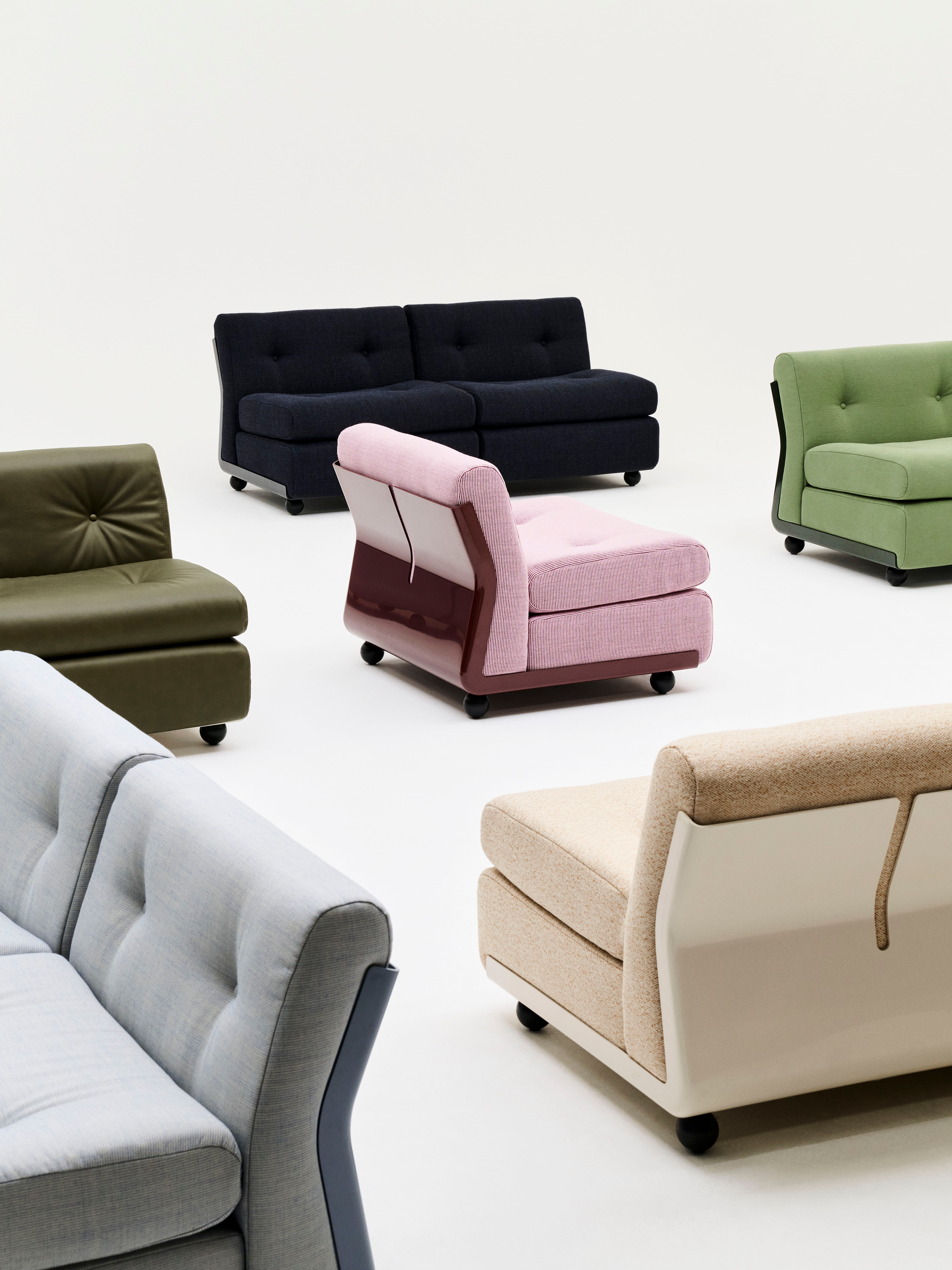 Chairs by Mario Bellini for Hay, with hard back and soft cushions, in colours including green, navy, pink, beige and gray