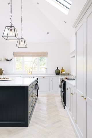 white kitchen with dark island