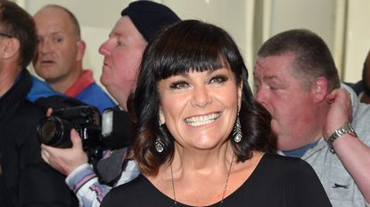 Dawn French has embraced short gray hair as she grows out her signature bob 