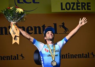 Michael Matthews celebrates on the Tour de France podium after winning stage 14