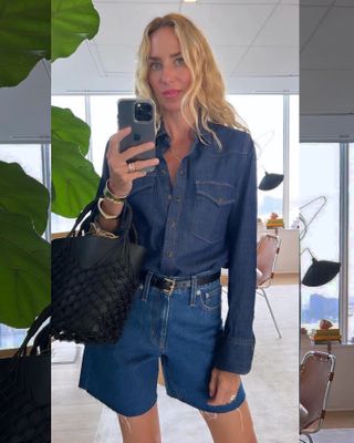 J.Crew's creative director Olympia Gayot poses for a mirror selfie wearing a denim-on-denim outfit with a denim button-down shirt, black belt, black netted bucket tote bag, and medium-wash denim cutoff shorts