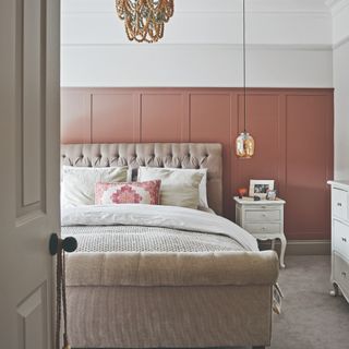 Grey bedroom with pink wall panelling