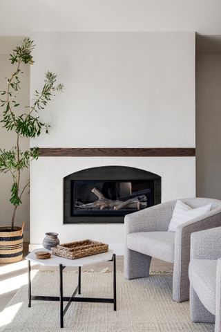 A living room with a sleek fireplace