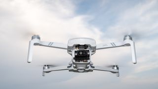 Holy Stone HS900 in flight against a cloudy sky