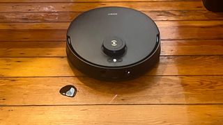 The Ecovacs Deebot T30S Combo robot vacuum cleaning a spill