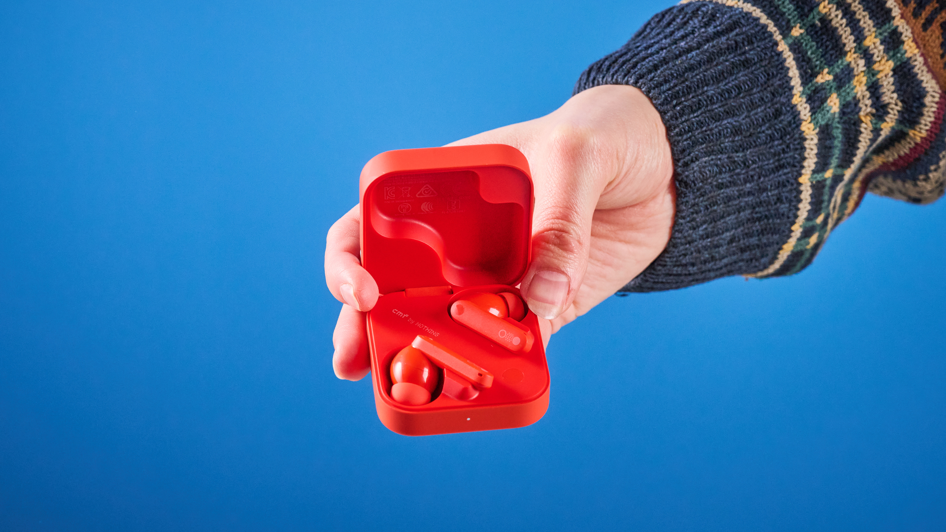 the nothing cmf buds pro 2 cmf by nothing buds pro 2 in bright orange shown in the smart dial charging case against a blue tom&#039;s guide background