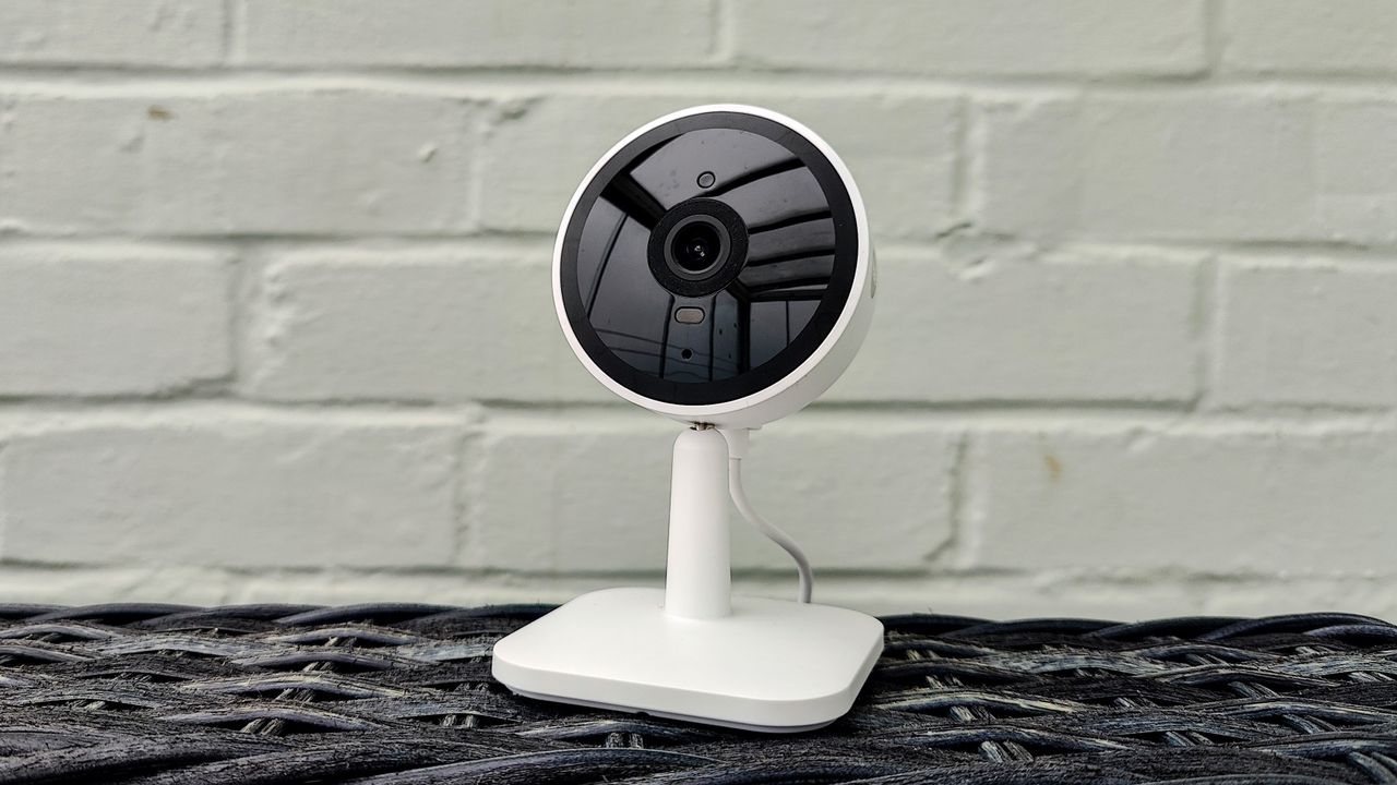 Yale Smart Indoor Camera review: security camera in front of painted brick wall