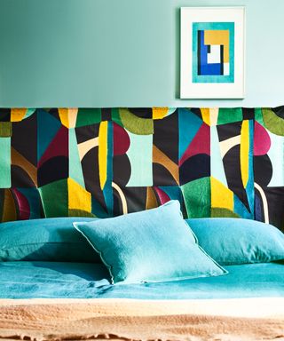 headboard upholstered with bold and colourful graphic pattern
