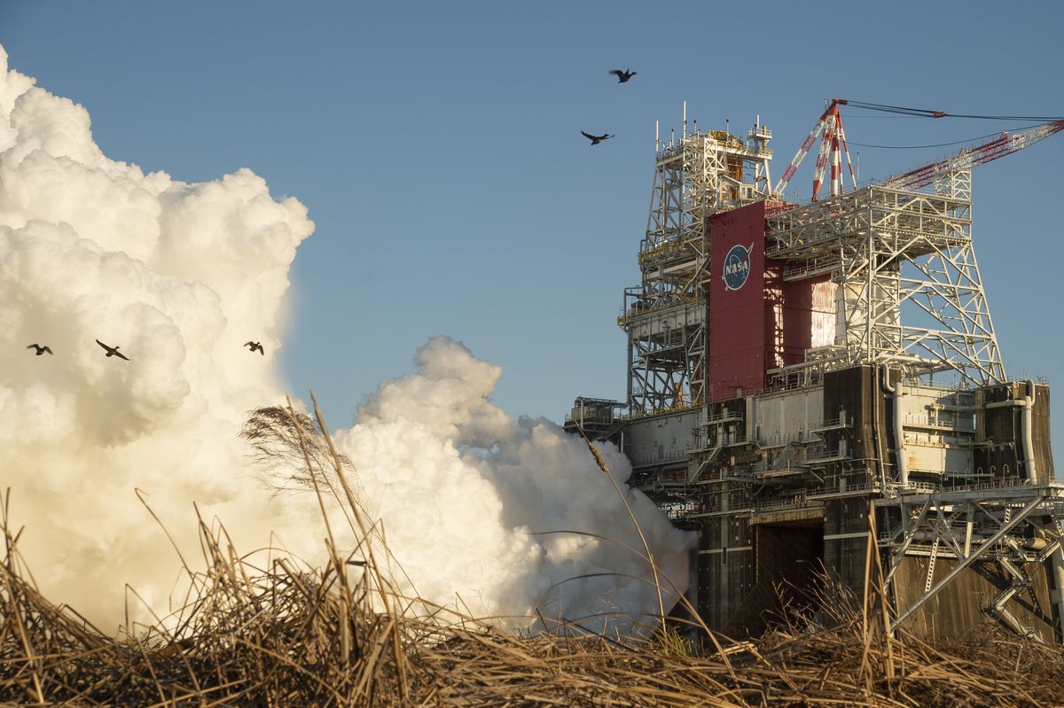 The core stage for the first flight of NASA’s Space Launch System rocket is seen in the B-2 Test Stand during a scheduled 8-minute hot-fire test on Jan. 16, 2021, at NASA’s Stennis Space Center in Mississippi. The four RS-25 engines fired for a little more than one minute.