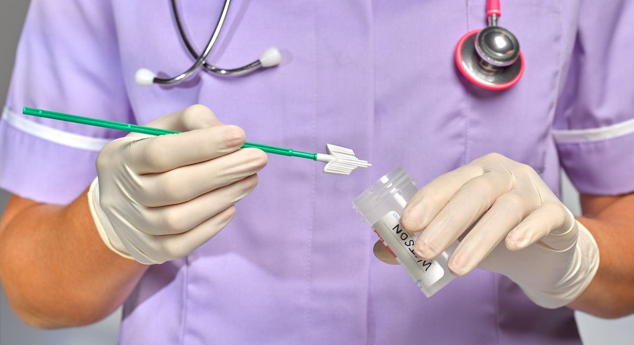 doctor holding a Pap smear swab