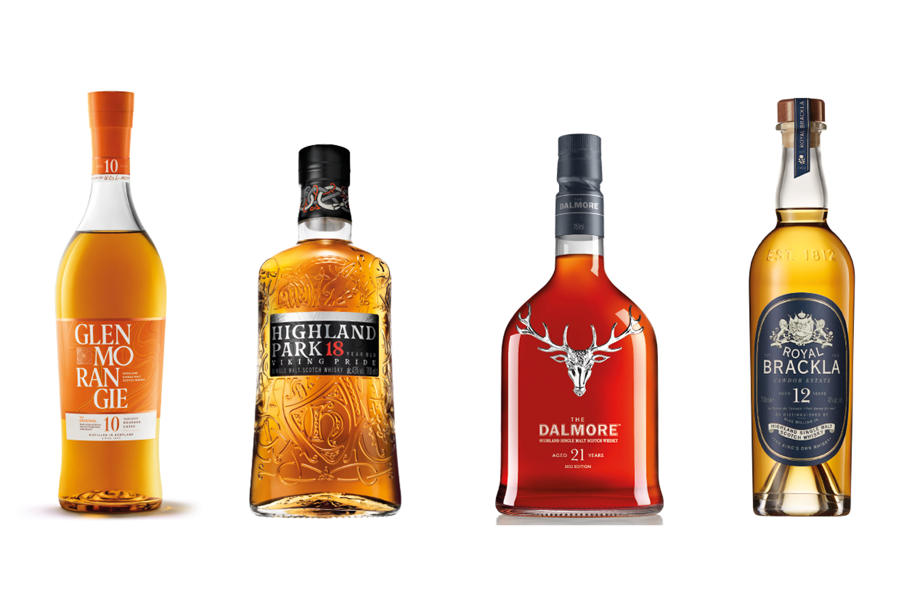 Four bottles of whisky against a white background