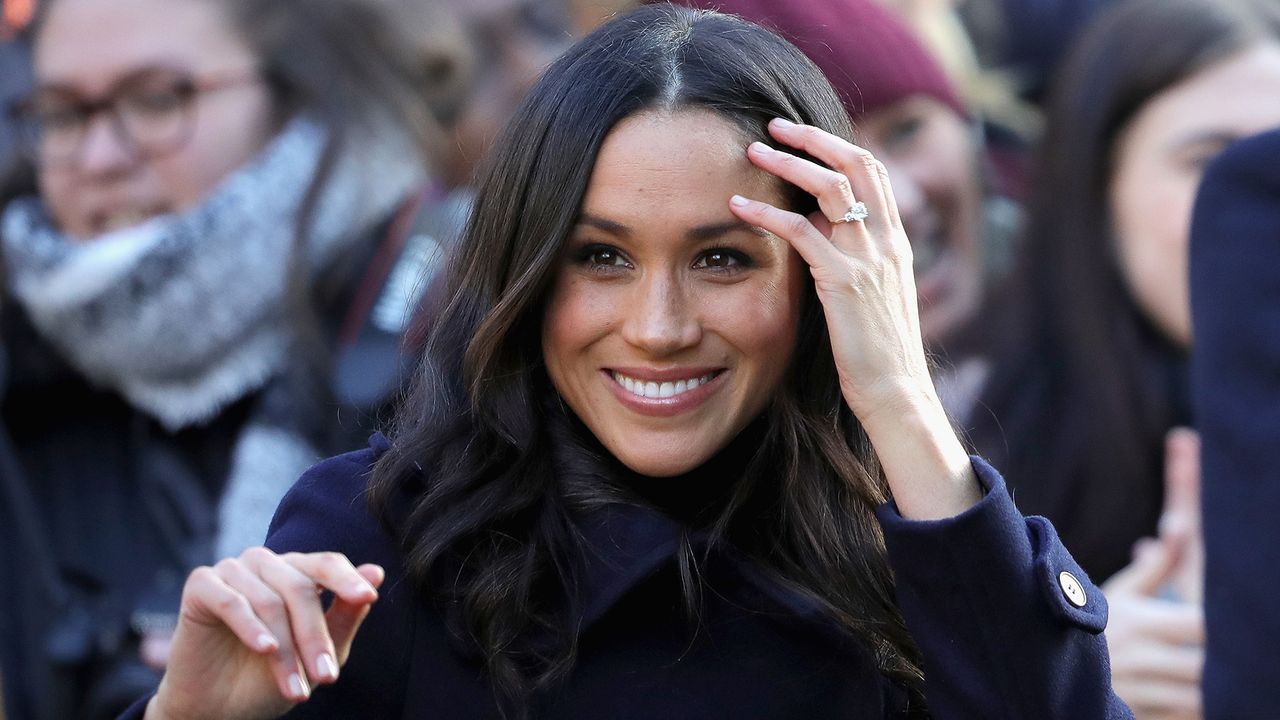 Meghan Markle shows off her engagement ring from Prince Harry.