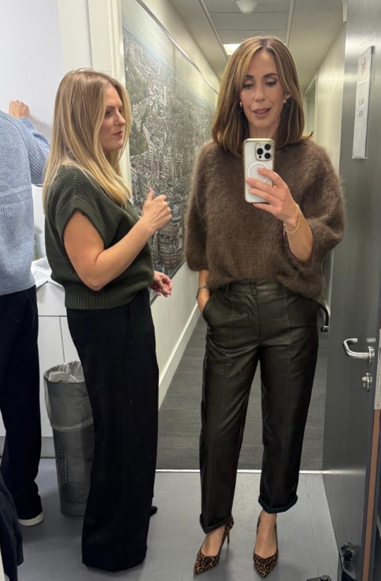 Screenshot of a picture of Alex Jones wearing leather trousers and a jumper and taking a photo, included in a carousel of Instagram pictures