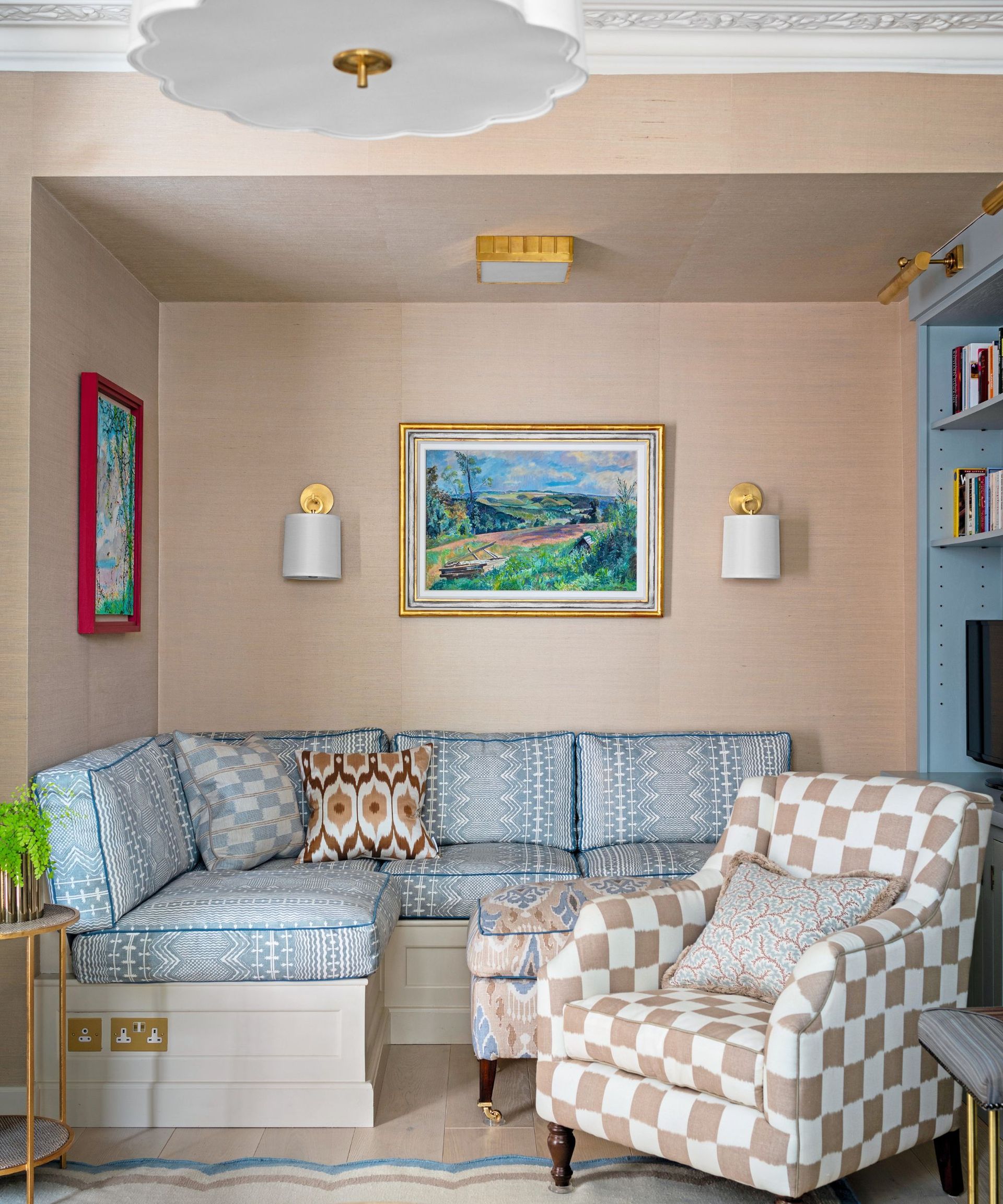 Pink walls, blue bench cushions, white and pink checked armchair