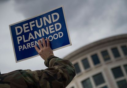 A sign protesting federal funding for Planned Parenthood