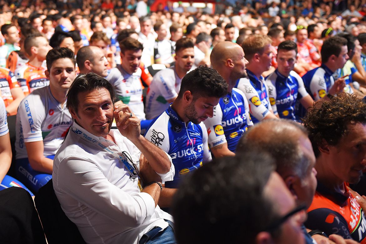 Quick-Step Floors DS Davide Bramati sits next to Fernando Gaviria