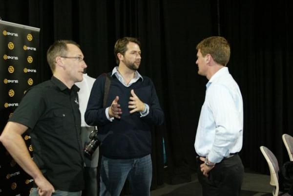 Andy Layhe of Bikepure and Benjamin Fitzmaurice of event sponsor Skins, talk with Floyd Landis