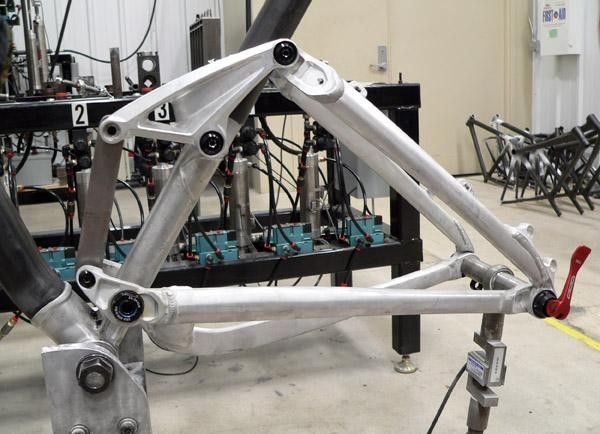 The vast majority of the front end of the new carbon Fuel EX is made of Trek's OCLV material, but engineers use a forged one-piece aluminium part that includes the bottom bracket shell and both main pivot locations for better reliability and more precise alignment.