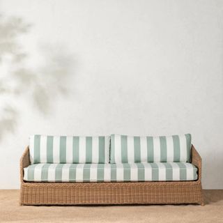 Haviland Outdoor Sofa with Striped Cushions against a white wall.
