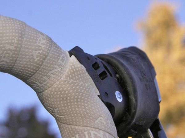Running the derailleur housing in front leaves a sharp edge at the rear of the lever though