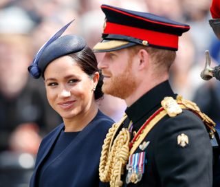 Meghan, Duchess of Sussex and Prince Harry, Duke of Sussex travel down The Mall in a horse drawn carriage during Trooping The Colour, the Queen's annual birthday parade, on June 8, 2019 in London, England.