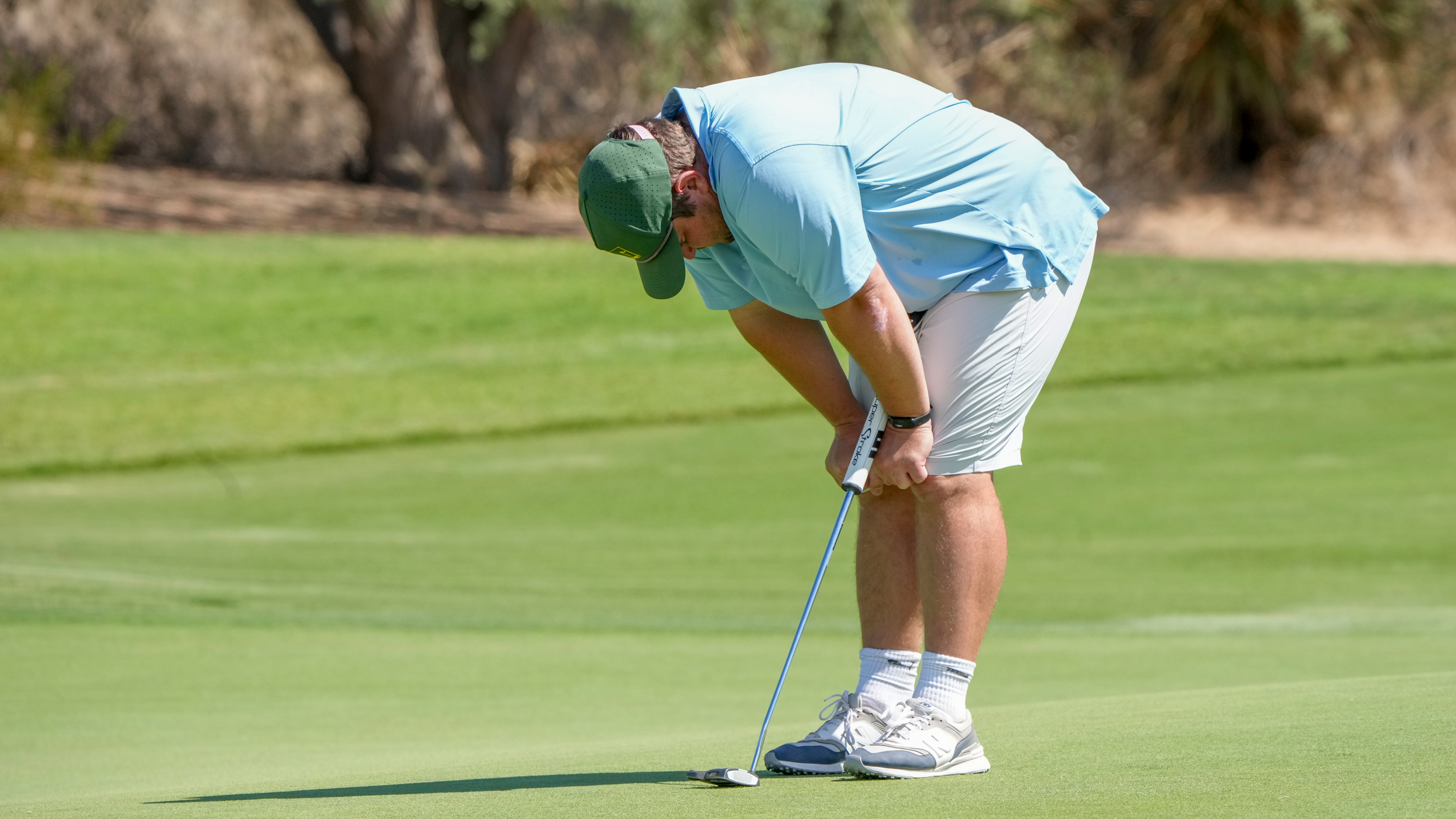 Paul Mitzel bends over and puts his hands on his knees after missing a putt at the 2025 US Mid-Amateur