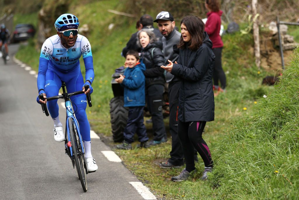 ARRATE SPAIN APRIL 09 Tsgabu Gebremaryam Grmay of Ethiopia and Team BikeExchange Jayco competes in the chase while fans cheer during the 61st Itzulia Basque Country 2022 Stage 6 a 1357km stage from Eibar to Arrate itzulia WorldTour on April 09 2022 in Arrate Spain Photo by Gonzalo Arroyo MorenoGetty Images