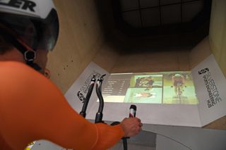 Aero testing in a windtunnel display in front of rider