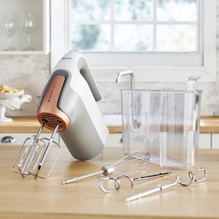 kitchen counter with hand mixer and mixer bowls
