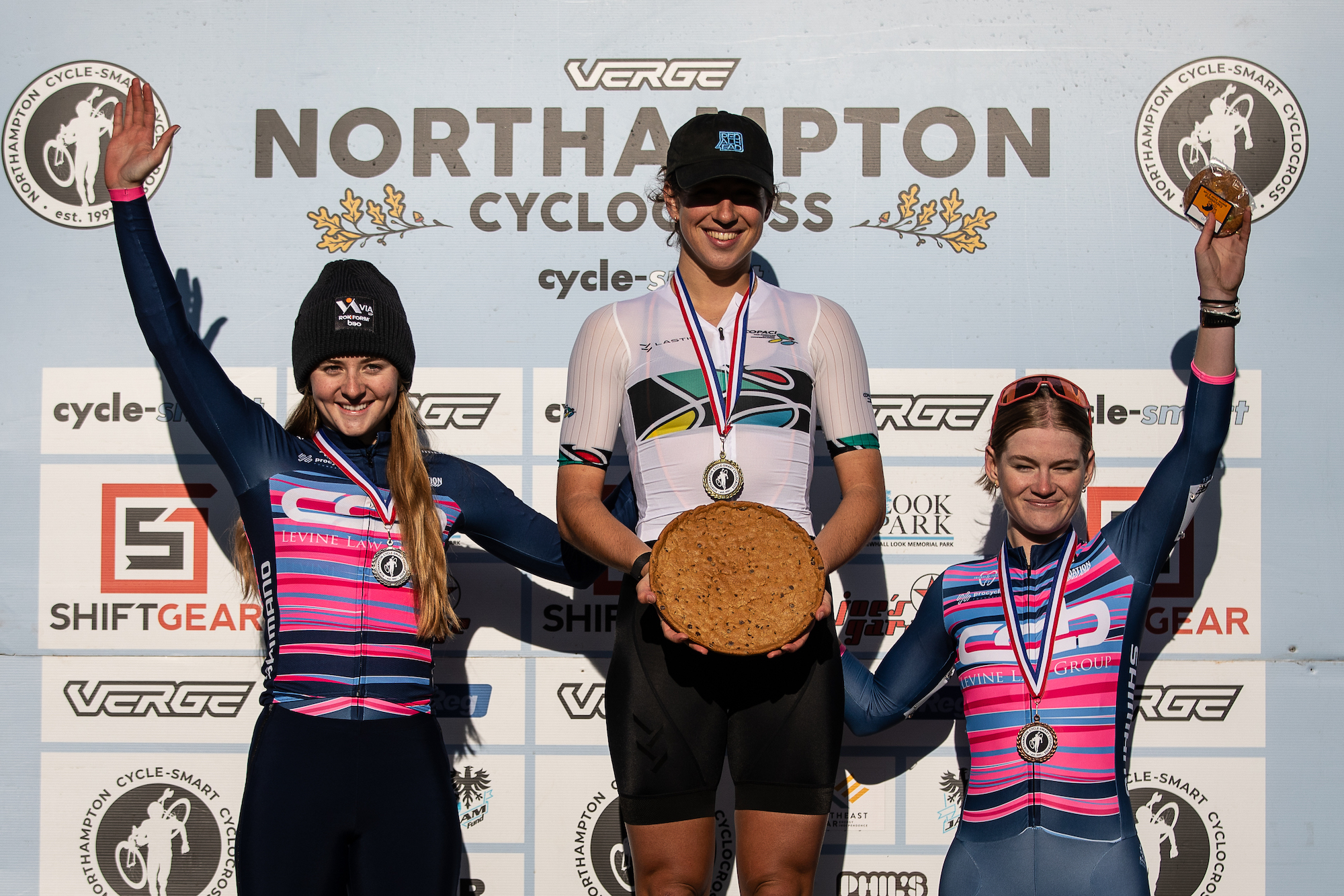 Northampton Cyclocross women’s podium day 1: second place Lizzy Gunsalus (CCB p/b Levine Law Group), winner Sidney McGill (Lastig Off-Road Racing) and third place Cassidy Hickey (CCB p/b Levine Law Group)