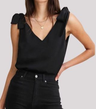 Image of black v-neck top