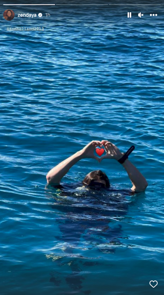 Tom Holland in ocean with heart hands