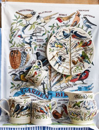 jug and mugs and tea towel with bird design