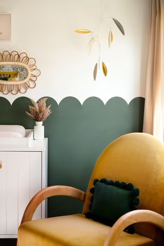 A corner in a nursery in emerald green paint