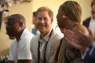 Duke of Sussex, smiles during his visit with Britain's Meghan (unseen), Duchess of Sussex, at the Lightway Academy in Abuja on May 10, 2024 as they visit Nigeria as part of celebrations of Invictus Games anniversary