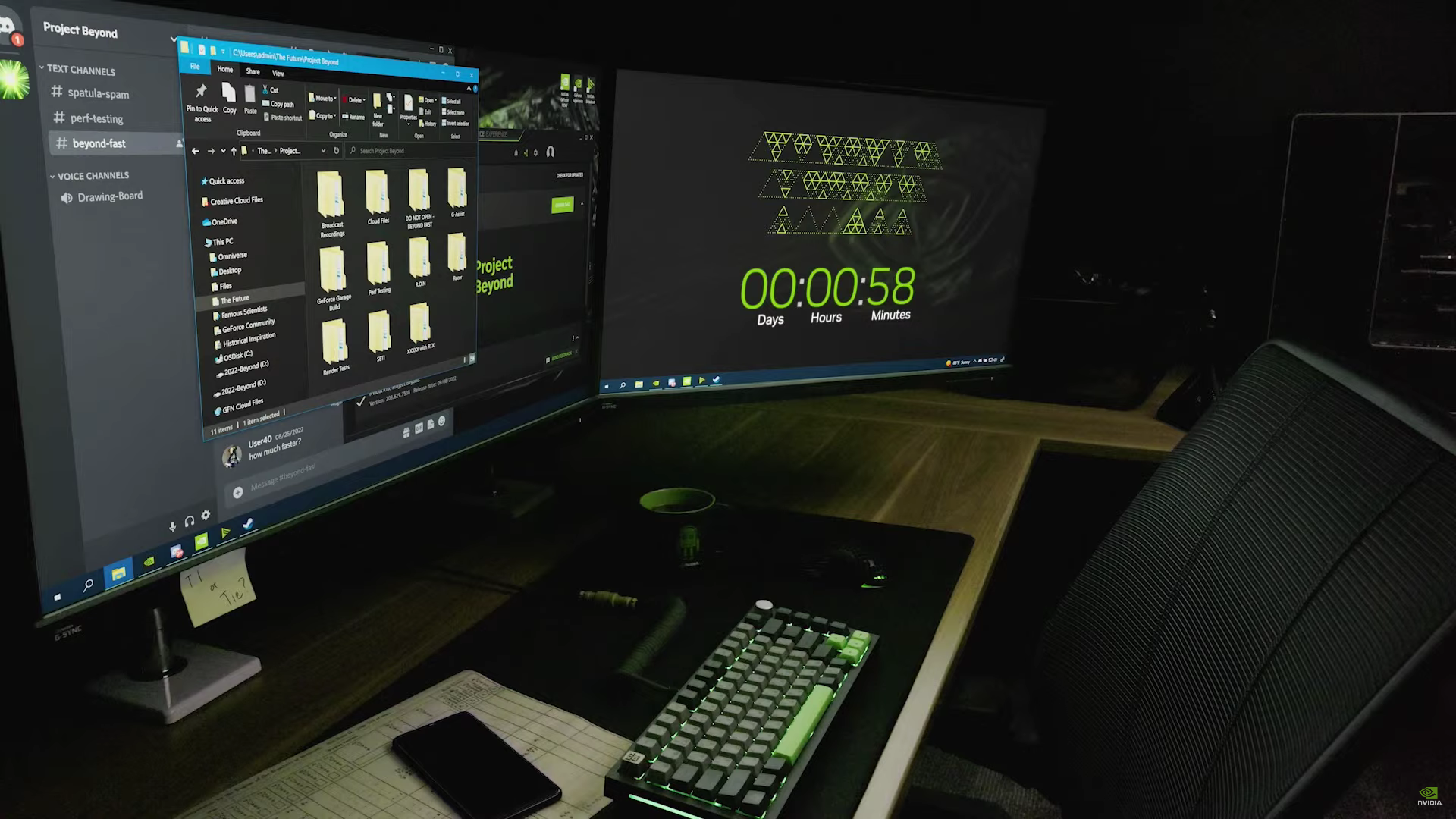 Dual-screen computer displaying a countdown on one screen and a desktop with Discord and file explorer open, showing 'Nvidia' teasers.