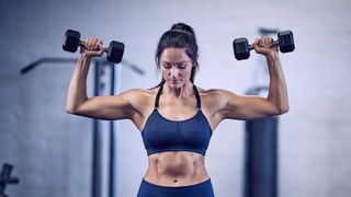 Woman doing a dumbbell arms workout