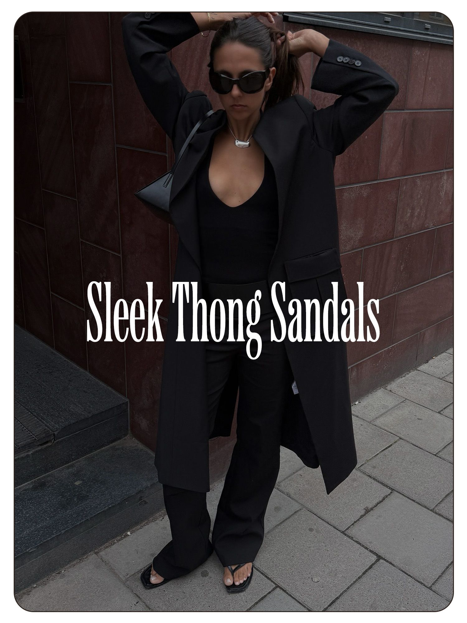 A photo of Hanna MW wearing a black outfit with sleek thong sandals.