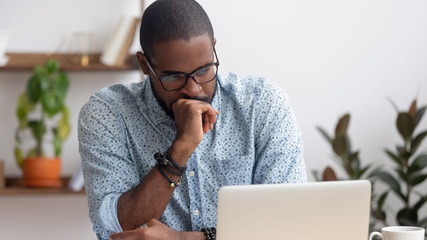 man annoyed at laptop