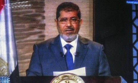 A screenshot of Mohamed Morsi delivering a televised speech in Cairo after he officially won Egypt&amp;#039;s first free presidential election on June 24: Morsi stressed that &amp;quot;national unity&amp;quot; is the o