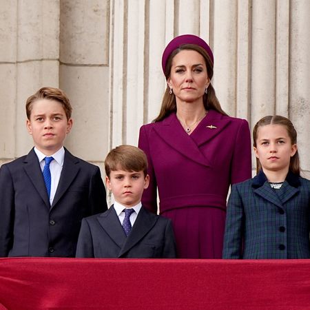 Prince George, Princess Charlotte, and Prince Louis stand on the balcony of Buckingham Palace.