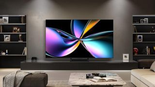 The Hisense U75QG Mini-LED TV staged in a modern living room on a wide credenza