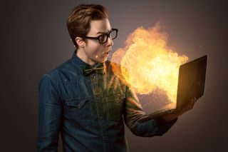 Guy with laptop on fire